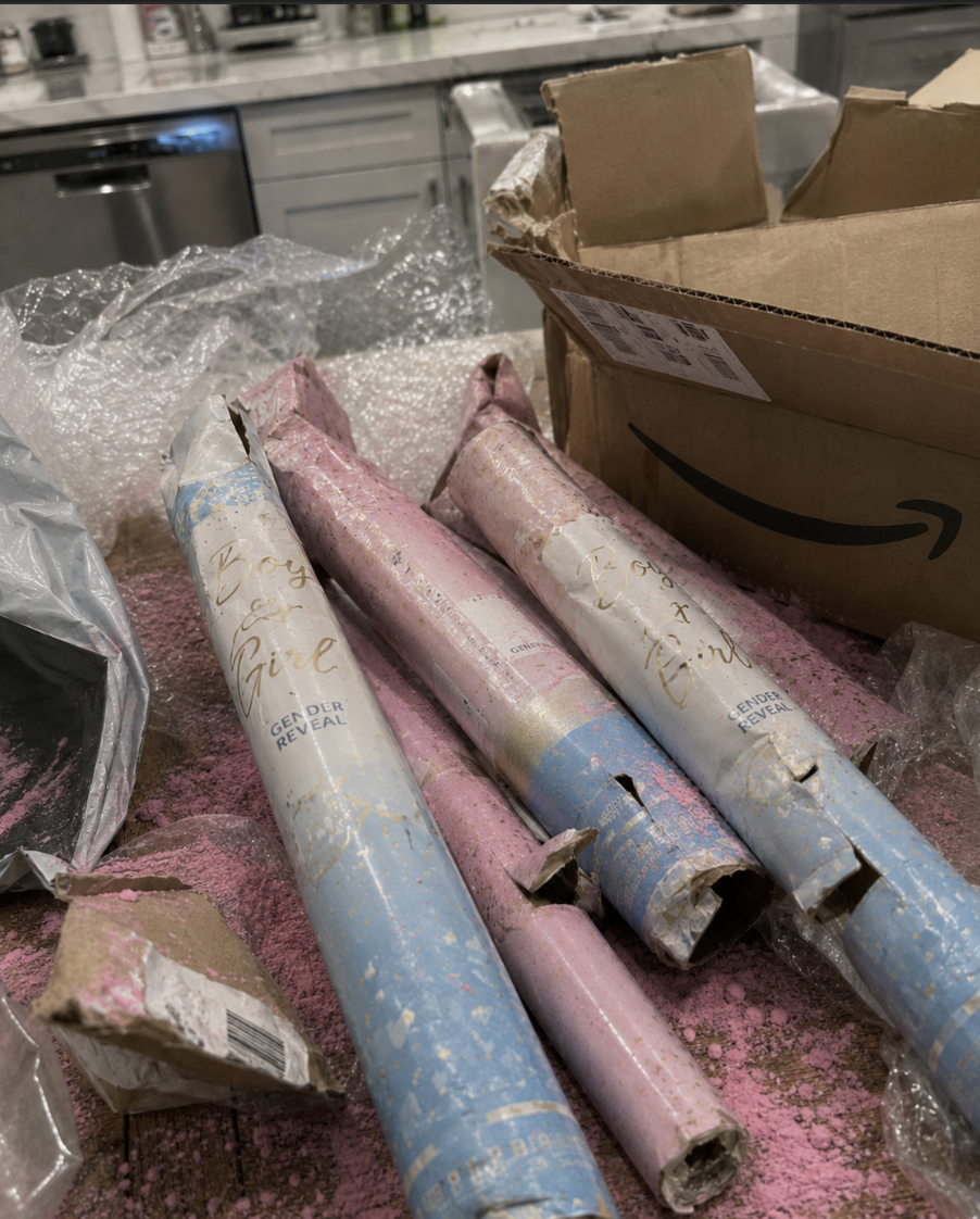 Cheap imported gender reveal cannons leaking pink powder all over a kitchen bench from an Amazon delivery